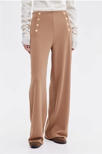 Detailed view of high-waisted brown wide-leg trousers with elegant gold buttons decoration