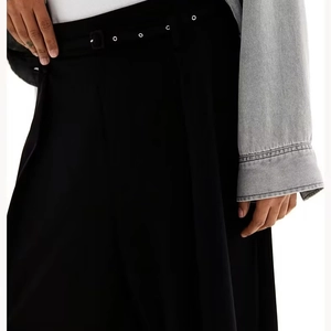 Women's high waist black wide leg pants with metal eyelet belt and classic minimalist style