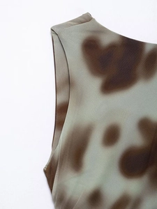 Detailed macro view of V-neck striped dress mesh fabric with earthy tie-dye texture