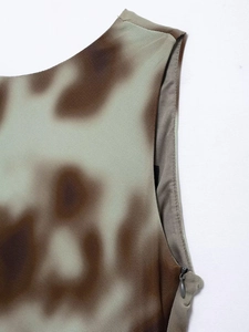 Close-up of moss green striped v-neck dress featuring breathable fabric and hidden zipper