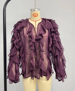 Detail view of deep purple chiffon blouse featuring layered ruffles and delicate buttons