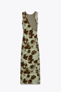 Detailed view of striped V-neck mini dress with waist cinch and wide pleated vest texture