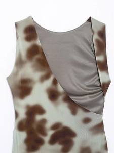 Detailed view of striped V-neck mini dress with brown tie-dye pattern and asymmetrical cutout