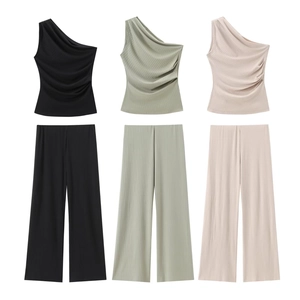 Detailed macro view of textured ribbed fabric on three sets of two-piece summer outfits