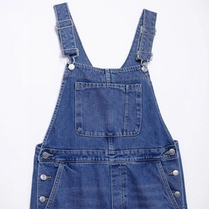 Classic dark blue denim overalls with adjustable metal buckles and front pocket detail