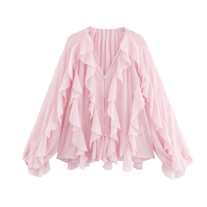 Close-up of pink V-neck chiffon blouse featuring layered ruffles and lantern sleeves