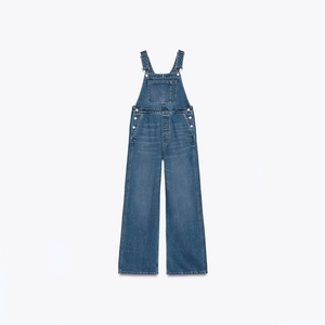 Women's casual medium blue wash denim overalls featuring wide leg and front pocket