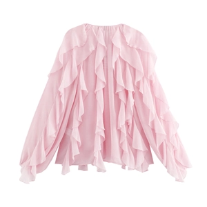 Detail of light pink chiffon blouse featuring elegant layered ruffles and lantern sleeves