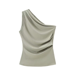 Detail of sage green ribbed fabric showing the one-shoulder design and side ruching