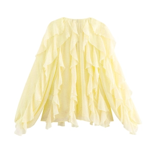 Close-up of lightweight pale yellow chiffon blouse featuring elegant layered ruffles and soft texture