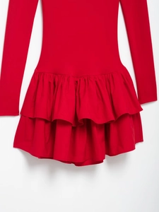 Detail shot of the layered ruffle hem on this elegant red long sleeve dress