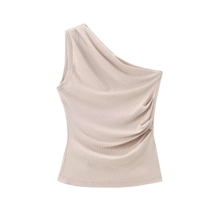 Close-up of ribbed knit texture and ruched side detail on beige one-shoulder top