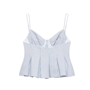Detail of blue and white striped camisole top with thin straps and peplum waist design