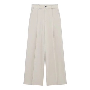 Detail view of high-waist beige wide-leg trousers with front pleats and draped silhouette