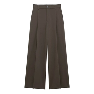 Detailed view of high-waisted pleated wide-leg trousers in olive green with classic belt loops