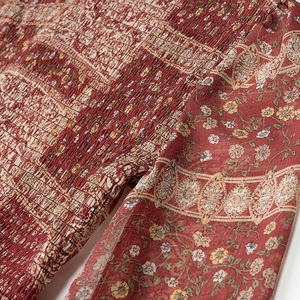 Detail of floral smocked bodice and chiffon sleeves on this vintage boho dress