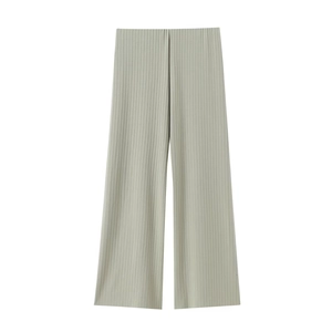 Macro detail of high-waist pleated wide-leg trousers in light grey green color