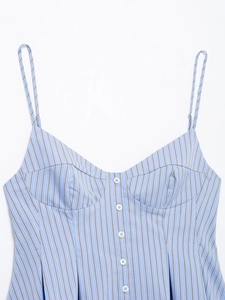 Close-up of a blue striped poplin top with heart-shaped neckline and buttons