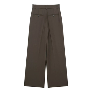 Detail view of the back of high-waist wide-leg trousers with elegant welt pockets and buttons