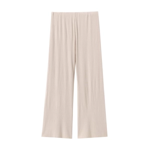 Detail of high-waist pleated wide-leg trousers in beige with fine vertical textures