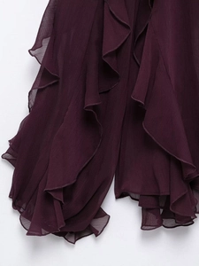 Detailed macro view of mulberry ruffled chiffon layers with delicate pleated texture
