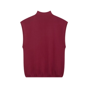 Detail of burgundy knit sleeveless top featuring a mock neck and fine ribbed texture