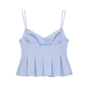 Detail of blue and white striped poplin top with V-neck and ruffled peplum hem