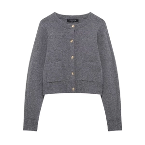 Close-up of charcoal grey knit cardigan with embossed gold buttons and ribbed texture