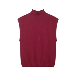 Detail shot of burgundy sleeveless knit vest featuring a mock neck and ribbed texture finish