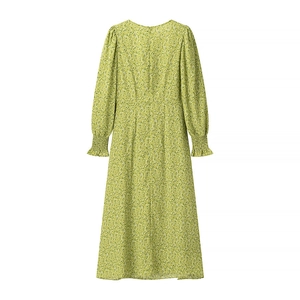 Green floral long sleeve A-line dress with smocked cuffs and cinched waist on white background