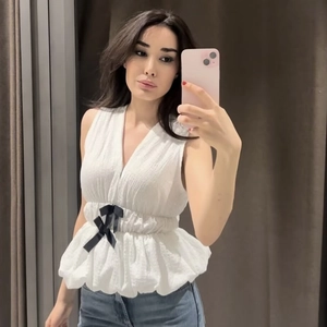 Women V-Neck Sleeveless Peplum Top White Textured Crinkled Fabric Elegant Smocked Waist Blouse With Black Bows For Summer Party