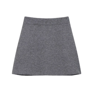 Close-up of grey knit mini skirt showing thick texture and wide elastic waistband