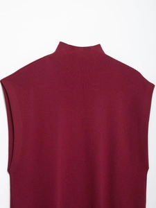 Detailed close-up of wine red mock neck knit top featuring high-quality ribbed texture