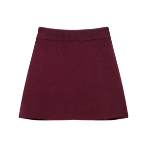 Detailed view of wine red A-line knitted skirt with elastic ribbed high waistband