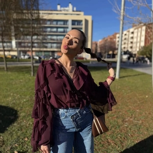 Elegant burgundy layered chiffon blouse with ruffles paired with high waist jeans