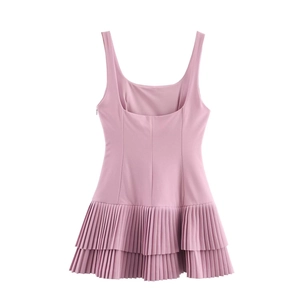 Detail of the pink sleeveless mini dress featuring double layered pleated skirt and high waist