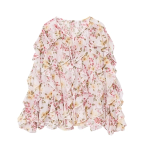 Detail of floral ruffled blouse featuring V-neck and delicate chiffon texture