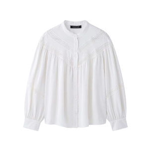 Detail of white long sleeve shirt with v-shaped lace patchwork and stand collar design