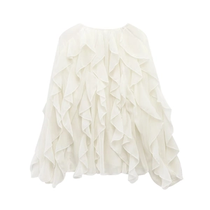 Close-up of elegant white V-neck blouse with layered ruffles and textured chiffon fabric