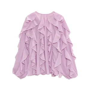 Detail of lavender chiffon blouse featuring layered vertical ruffles and soft texture