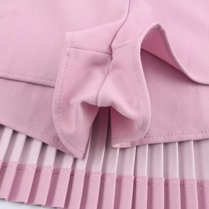 Detail of pink pleated skort showing the inner lining fabric and fine stitching