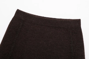 Detail of dark brown knitted elastic waist with premium ribbed texture and neat stitching