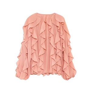 Detail of coral pink ruffled chiffon blouse showing pleated cascading layers and lantern sleeves