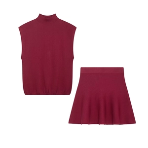 Women's burgundy two-piece knit set featuring a sleeveless turtleneck top and A-line skirt