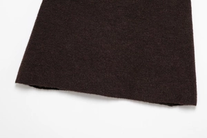 Close-up of deep brown thick knit fabric texture with minimalist clean edge detail
