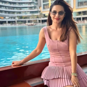 Pink sleeveless mini dress with pleated cake skirt and slim fit design for women