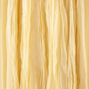 Elegant yellow pleated maxi skirt for women with lightweight breathable fabric texture
