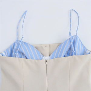 Detail of invisible zipper and blue striped lining on beige poplin summer dress