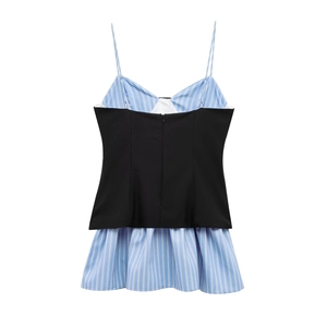 Detail of a poplin patchwork dress featuring blue stripes and back invisible zipper