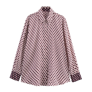 Detail of classic lapel and button-down front on red and black geometric print shirt
